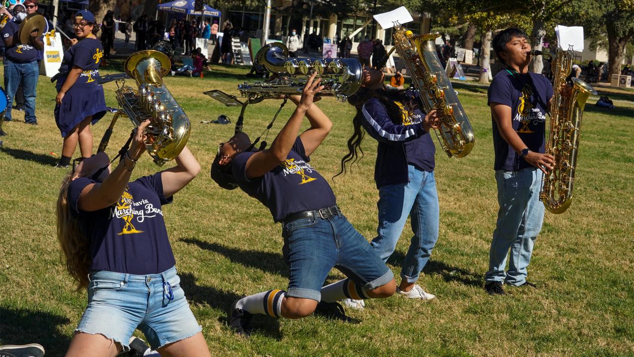 Marching band performers play at pep rally