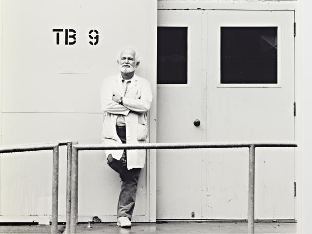 professor standing next to TB9 wall