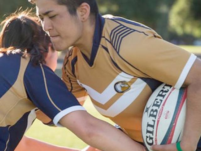 Two women's rugby players collide in practice