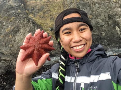 Jacqueline Rajerison poses with a starfish at Bodega Bay