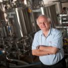 Photo of Charlie Bamforth, Anheuser-Busch Endowed Professor of Malting and Brewing Sciences Emeritus in a brewing classroom.