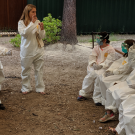 Dr. Tracey Goldstein instructs campers in Tyvek suits