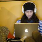 A female student looks at her laptop