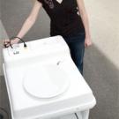 photo: woman with square boxed toilet