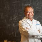 Chemist Carlito Lebrilla in front of blackboard