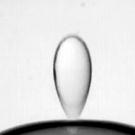 Photo: droplet of water bouncing off surface