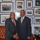 Rep. John Lewis and Chancellor Gary S. May, in posed photo against wall of photos.
