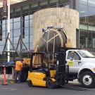 Photo: Forklift loads "Gong" onto a flatbed truck.