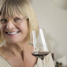 Jancis Robinson holds a glass of wine