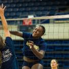 Kelechi Ohiri at the net during a volleyball practice