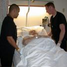 Daniel Jones, left, and Woody Waite, right, are among the new Lift Team members who have helped reduce pain and injuries suffered by nurses from lifting patients.