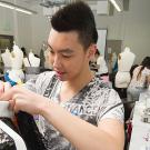 Dennis Liu prepares a menswear outfit 