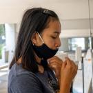 Katherine Yanogacio self-administers nasal swab test.