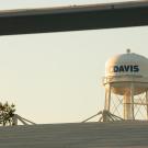 UC Davis water tower in background, with solar panels in foreground.