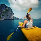 A study abroad student kayaks in Vietnam
