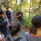 Andrew Fulks speaks to class along the Arboretum Waterway.