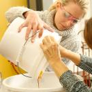 Two students in "Mead 101" prepare their first batch of mead.