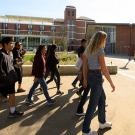 Junior Zach Luis leads a tour group past the Memorial Union.