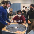 Junior high students construct air purifier in a classroom 