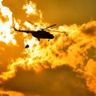 Helicopter flies into burning fire