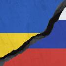 Flags of Ukraine and Russia, broken in the middle