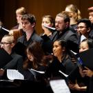 Choristers in black singing at UC Davis event