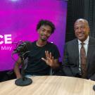 Ahmed Eltayeb and Chancellor Gary S. May pose for photo in studio.