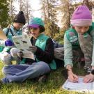 Girl scouts in pink and blue clothes working on patch exercise at UC Davis