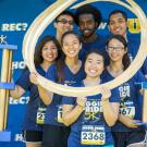 Runners pose in photo booth.