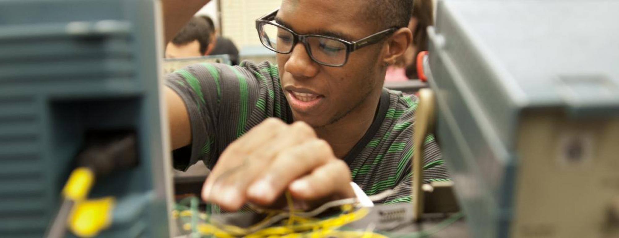 uc davis applied physics student works with circuits