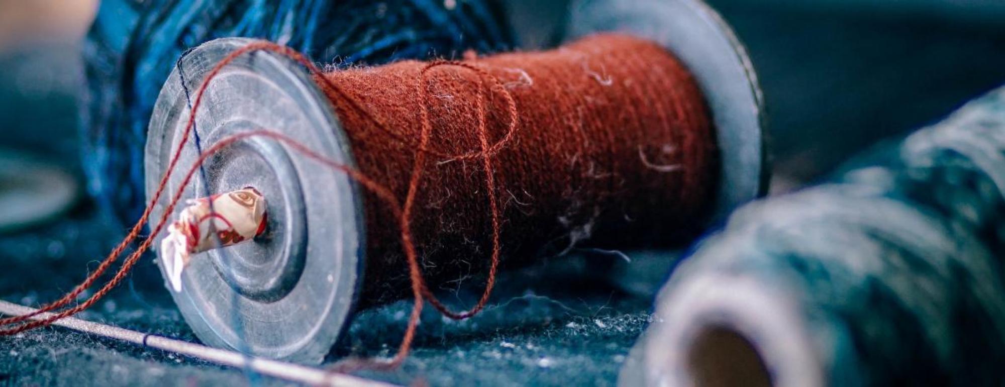 zoomed in image of spools of yarn