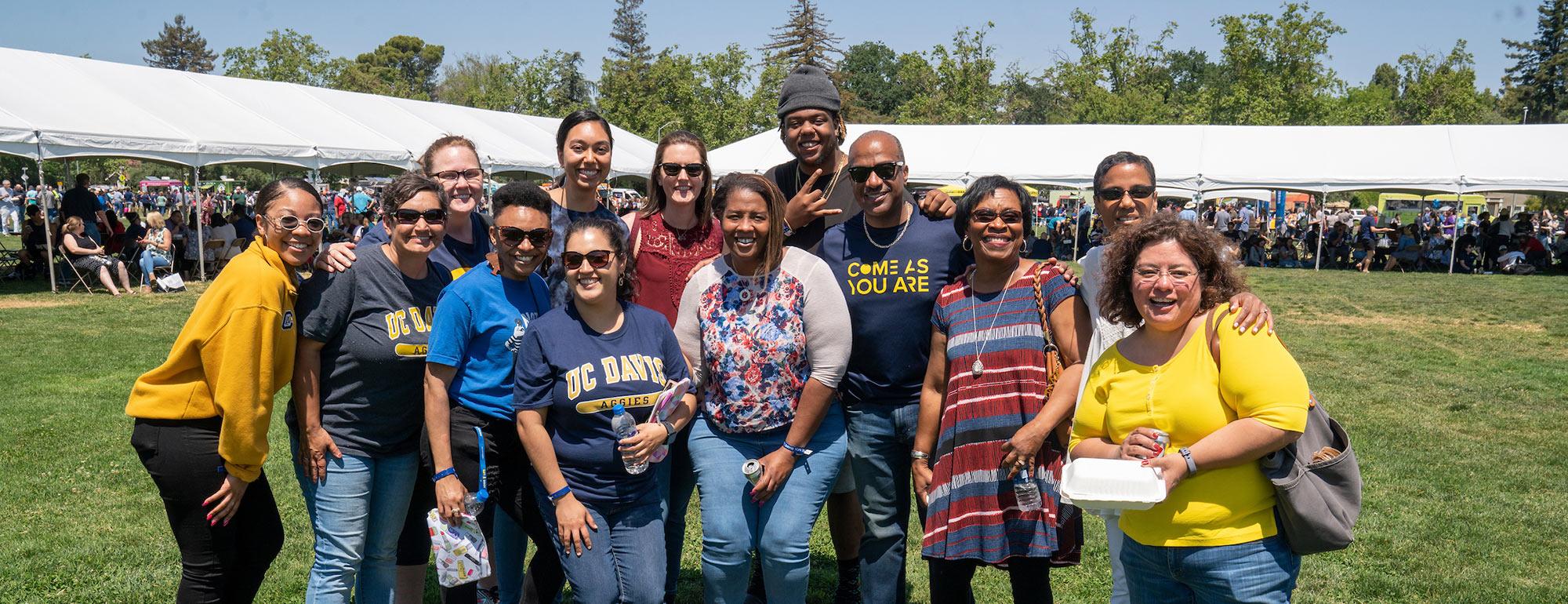 A group of UC Davis staff members pose with Chancellor May at the annual Thank Goodness for Staff event
