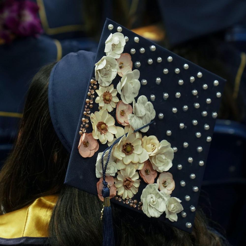 A decorated graduation cap at UC Davis commencement
