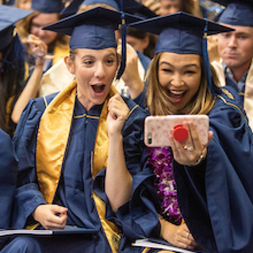 Students cheer graduation at UC Davis. 