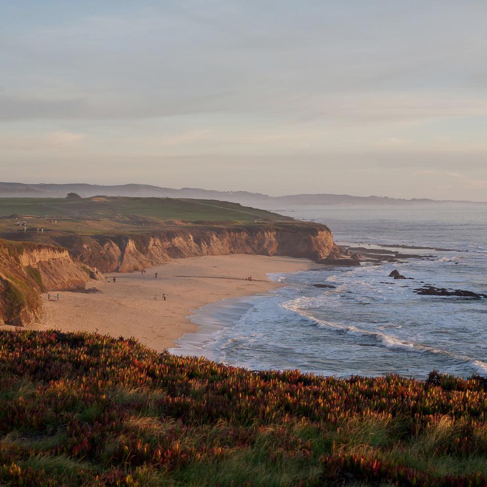 A scenic view of the coastline and manhatten beach in Half Moon Bay, ca
