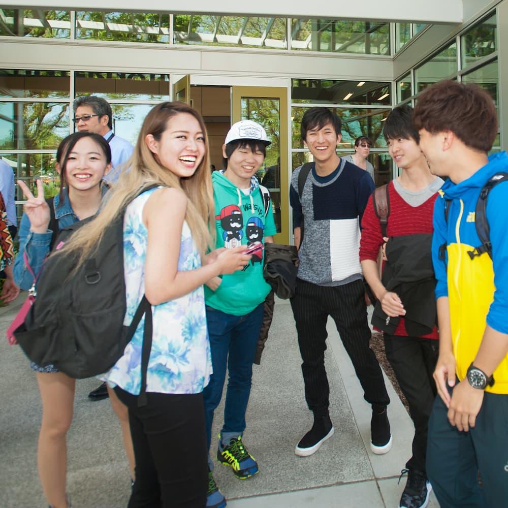 International students standing in front of the international center at UC Davis.
