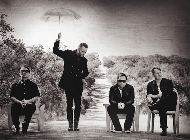 A promotional photo of the four members of the band Blue October.