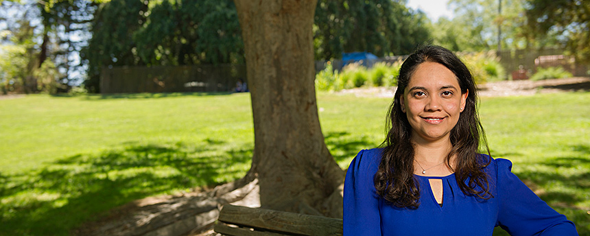 Engineering assistant professor Cindy Ruiz sitting on a bench