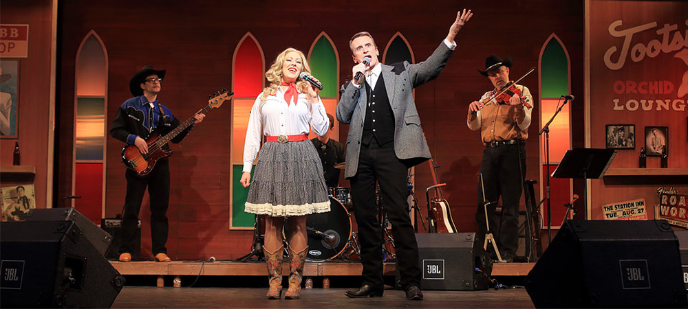 The cast of Classic Nashville Roadshow performing on stage.