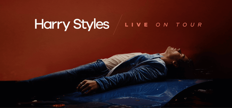 Harry Styles lying on his back with his eyes closed.