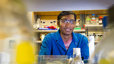 male student in research lab