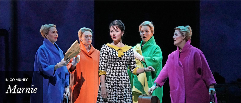 Five female characters,including Marnie, played by mezzo-soprano Isabel Leonard wearing colorful mid-century period dresses.