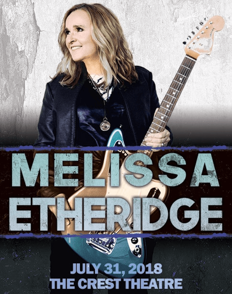 Melissa Etheridge holding an electric guitar.