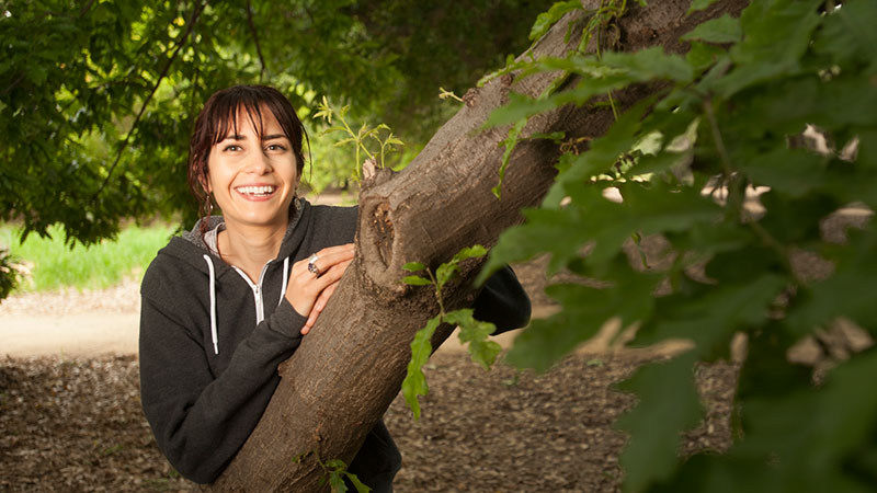 A woman in the UC Davis Arboretum