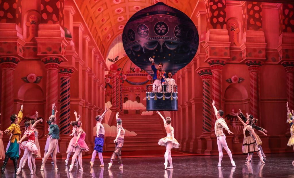 Ballet dancers on stage performing a scene from "The Nutcracker."