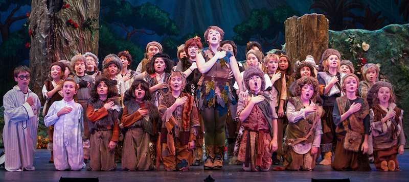 A photo of the entire cast of Peter Pan singing on stage.