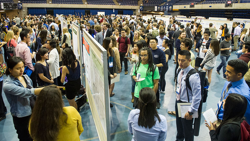 Students discuss research at poster session