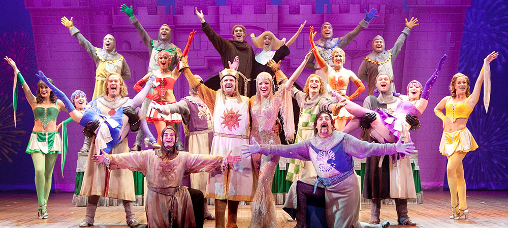 The cast of Spamalot on stage.