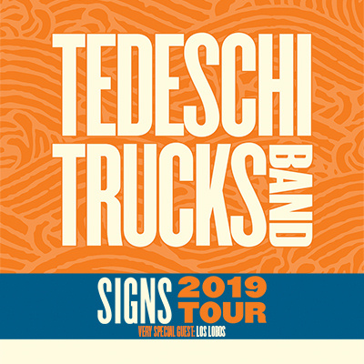 An orange and blue logo featuring the band's name and the name of the tour.