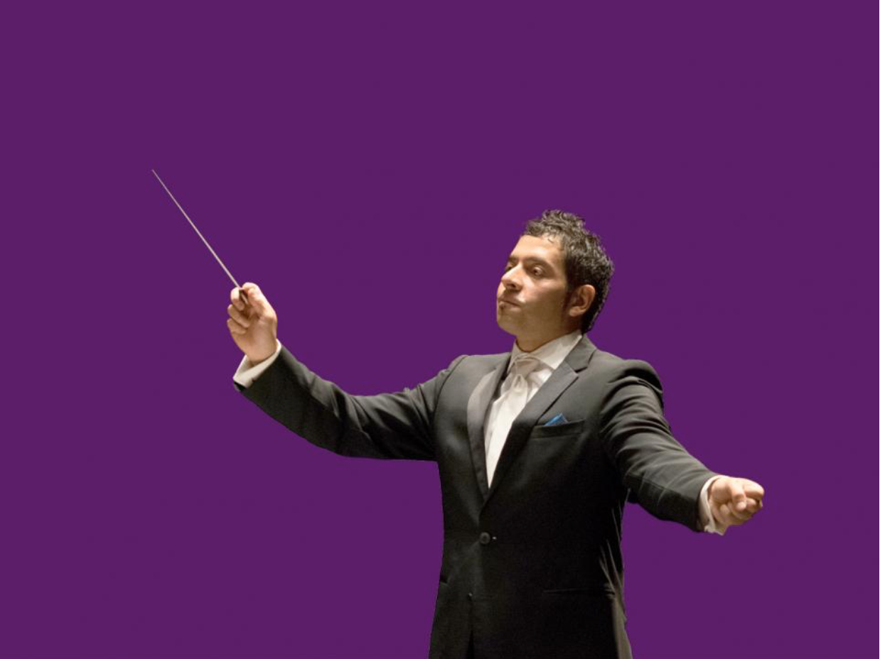 Christian Baldini conducting the orchestra.